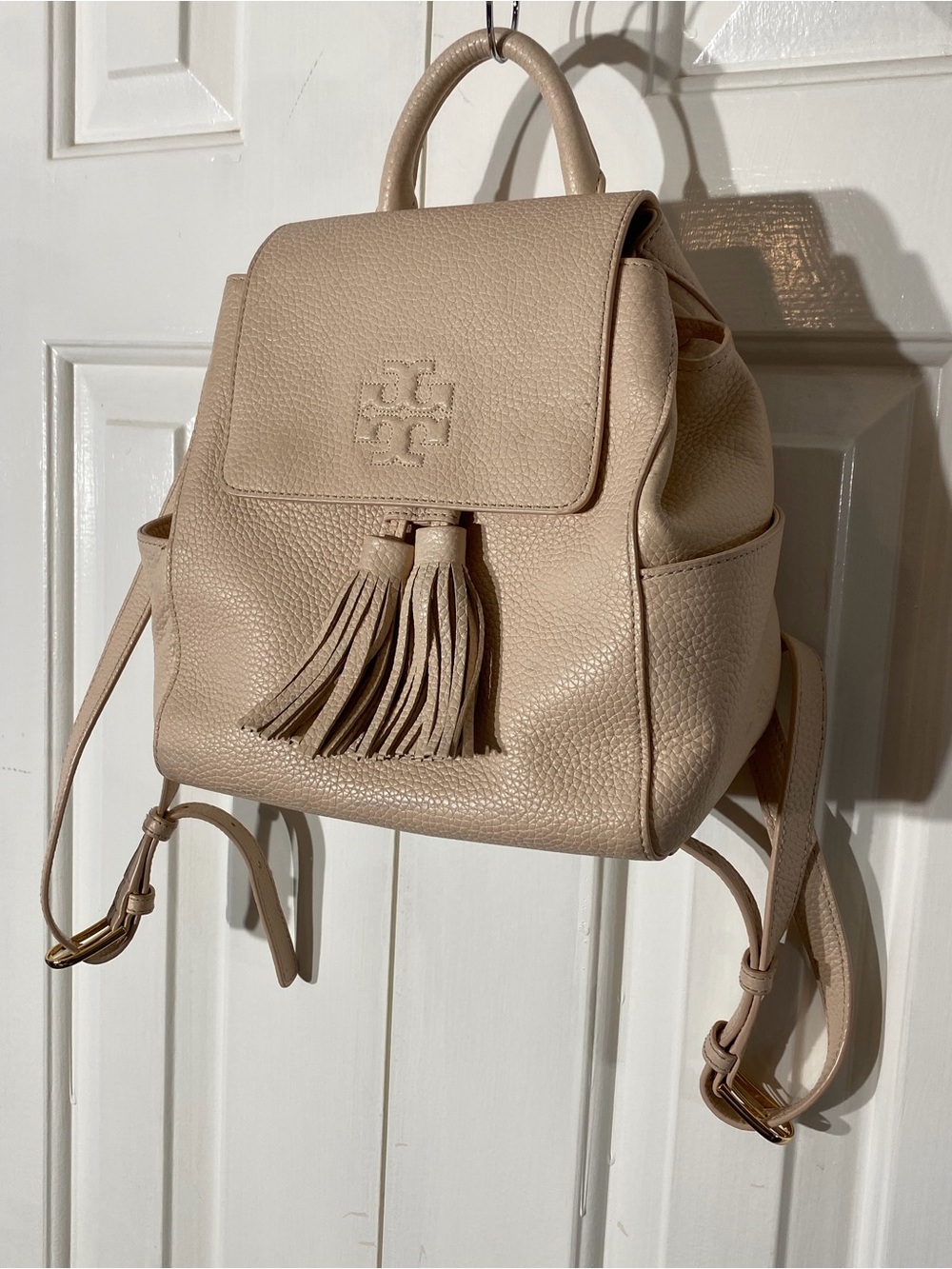 Tory Burch Pebbled Leather Tassel Backpack in Light Pink